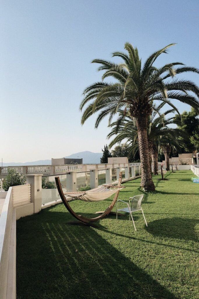 pexels-photo-1520619-1520619 Relax by the ocean with a hammock and palm trees at a serene resort.